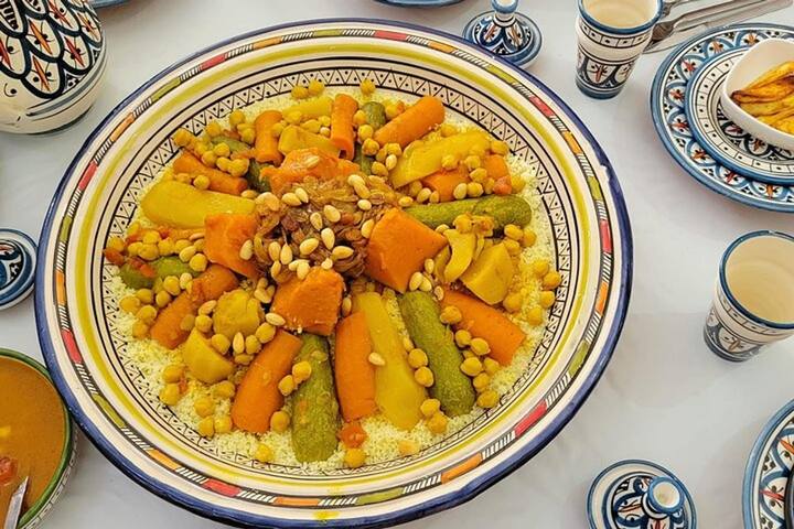 Couscous with vegetables on a painted platter