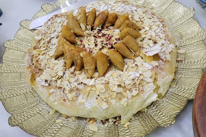 Golden pastilla topped with flaked almonds